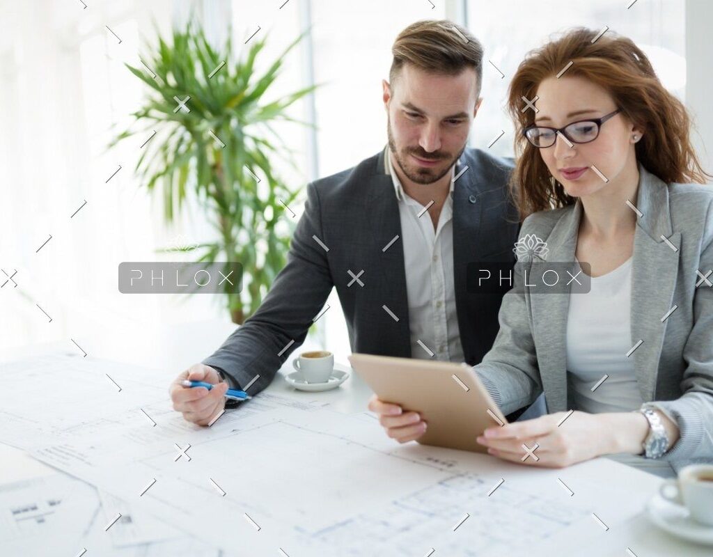 demo-attachment-818-portrait-of-young-architect-woman-on-meeting-KFZCE3A